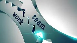 two cogs with "team" and "work" engraved